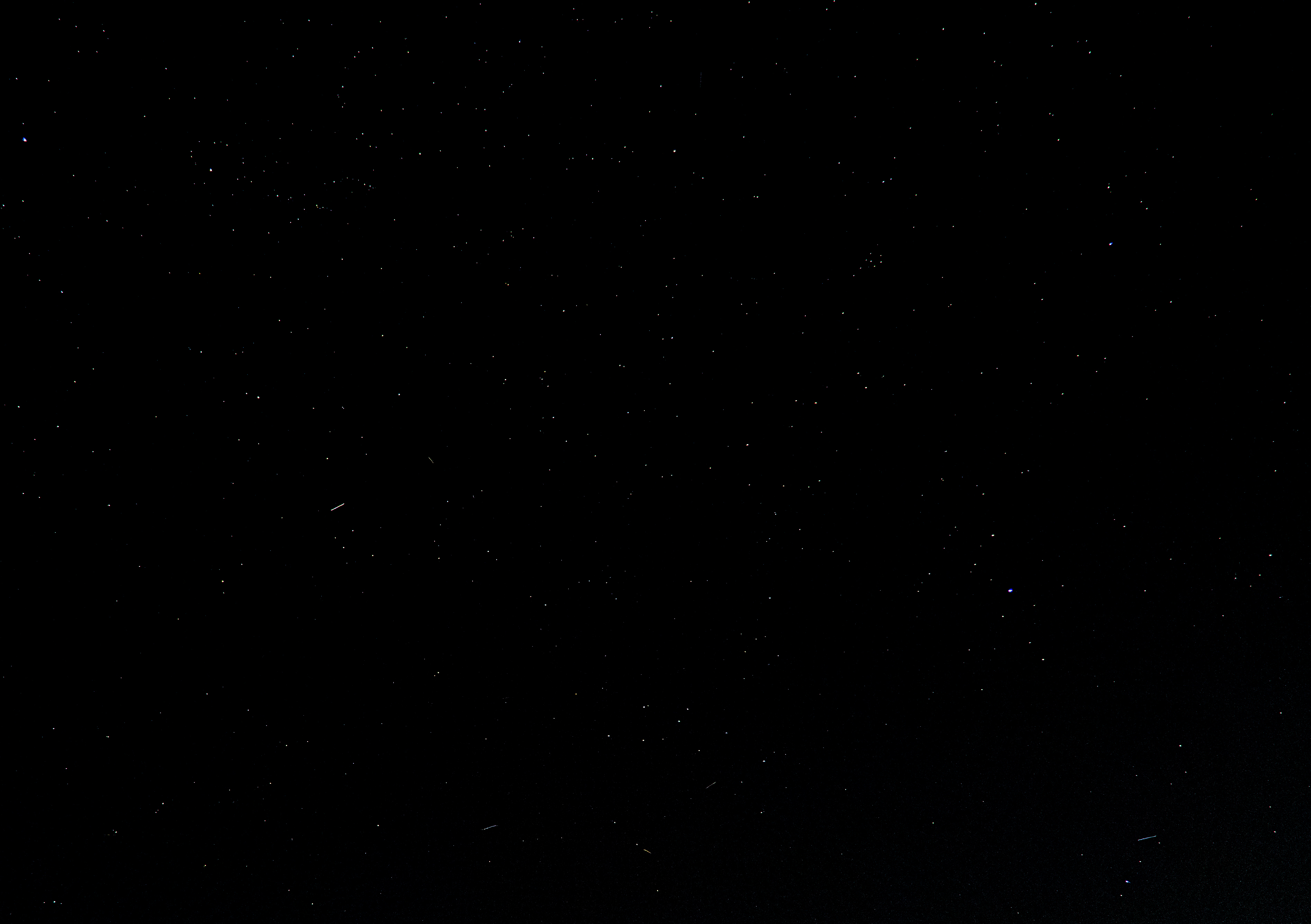 Stars scattered across a dark night sky in a long exposure